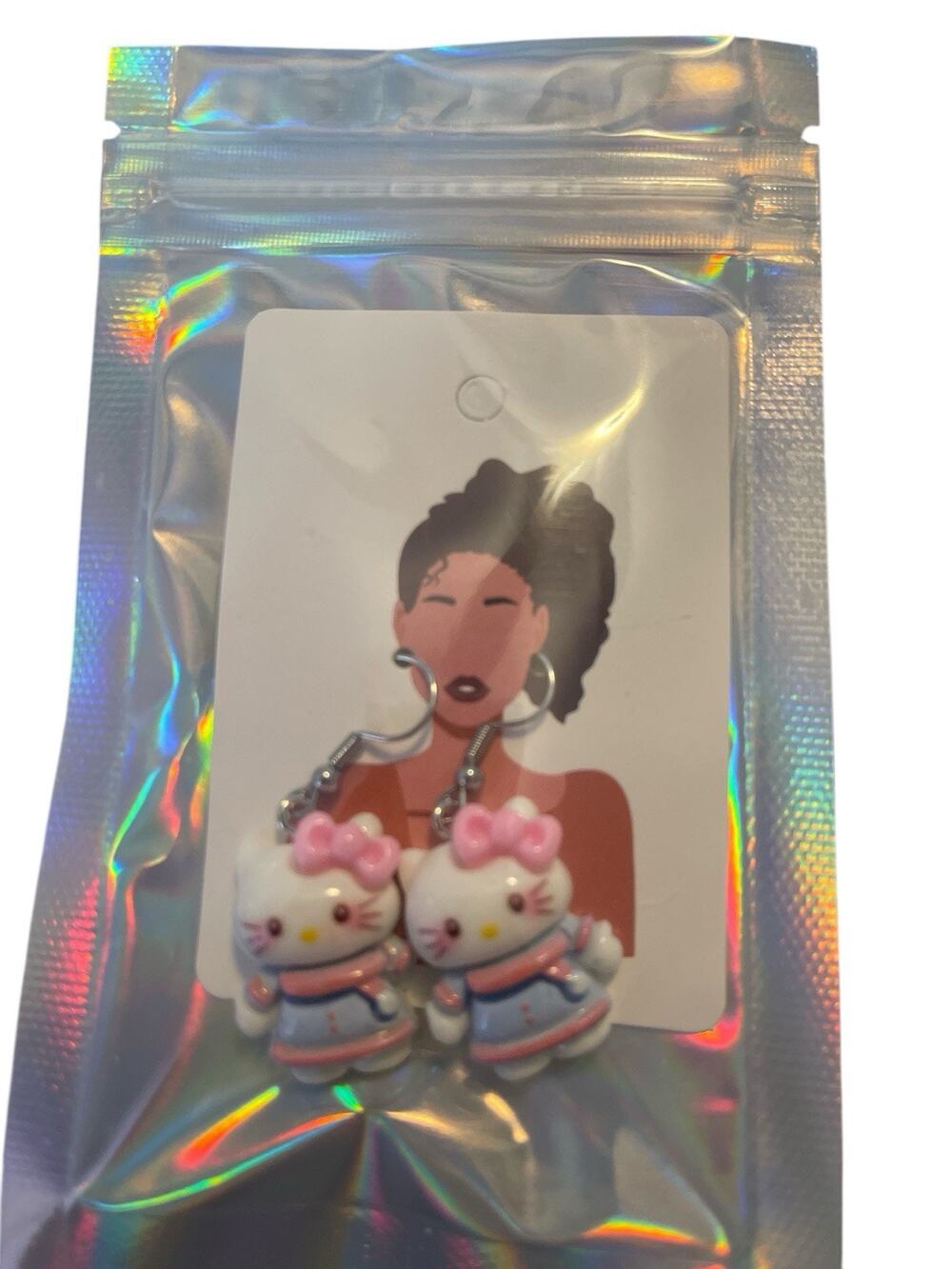 HELLO KITTY SILVER DANGLE EARRING WITH PINK BOW AND BLUE OUTFIT